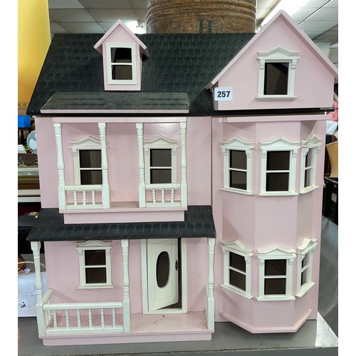 257 - LARGE PINK PAINTED DOLLS HOUSE