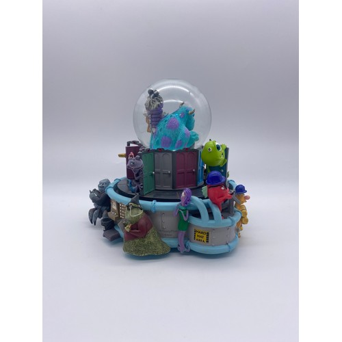 289 - DISNEY AND PIXAR MONSTERS INC. MONSTROPOLIS SNOW GLOBE