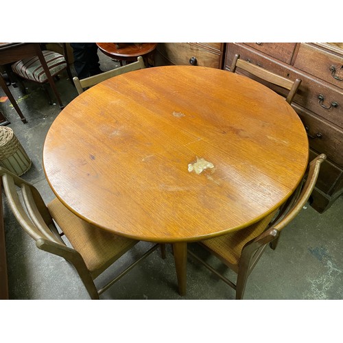 149 - TEAK CIRCULAR EXTENDING DINING TABLE AND FOUR CHAIRS