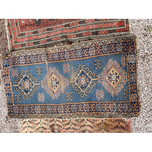 80 - THREE SMALL LATE 19TH CENTURY CAUCASIAN CARPETS/MATS