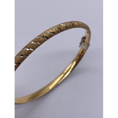 598 - SILVER GILT BANGLE