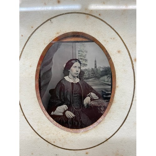 587 - OVAL MOUNTED PHOTOGRAPH OF A SEATED FEMALE IN GILT BEADED FRANME