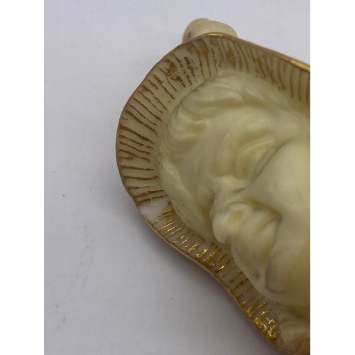 545 - ROYAL WORCESTER BLUSH IVORY FIGURAL CANDLE SNUFFER (SLIGHT CHIP)