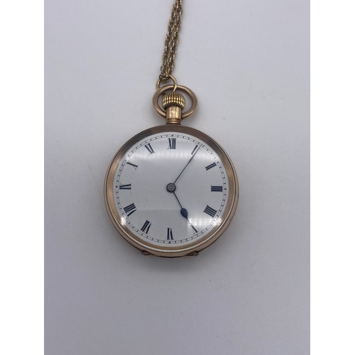 569 - 9CT ROSE GOLD CASED POCKET WATCH WITH ROMAN NUMERAL DIAL ON A 9CT GOLD CHAIN 30.7G OVERALL