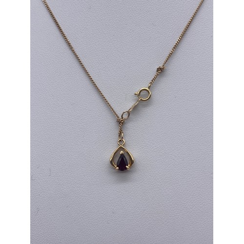 575 - YELLOW METAL AND RED STONE TEAR DROP PENDANT ETCHED 14K A ON 14K CHAIN 2.1G OVERALL