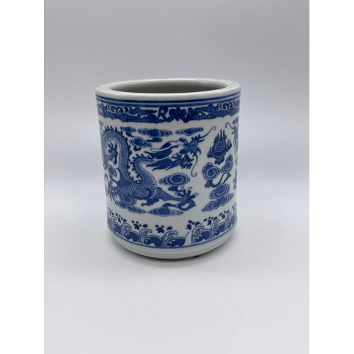 566 - CHINESE BLUE AND WHITE TRANSFER PRINTED BRUSH POT, TRIPOD TEACUP, TWO CARVED MONK FIGURES AND A TWIN... 