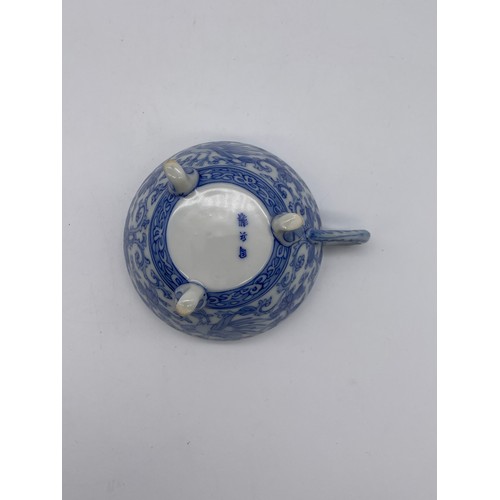 566 - CHINESE BLUE AND WHITE TRANSFER PRINTED BRUSH POT, TRIPOD TEACUP, TWO CARVED MONK FIGURES AND A TWIN... 