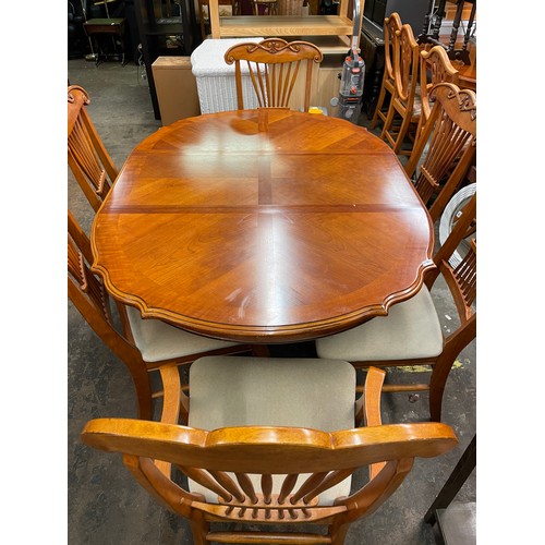 79 - CHERRY WOOD SERPENTINE CROSS BANDED DINING TABLE AND SIX CHAIRS