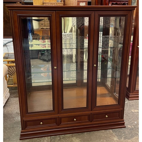 138 - G PLAN CHERRY WOOD THREE DOOR DISPLAY CABINET WITH DRAWER BASE