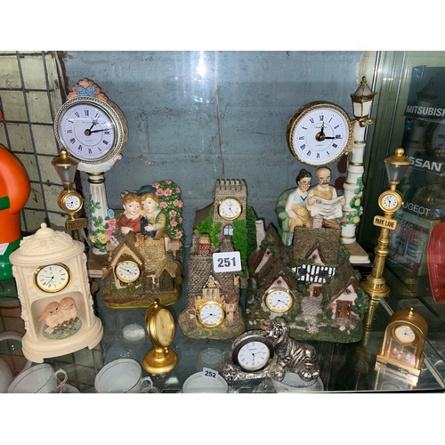 251 - SELECTION OF RESIN COTTAGE MANTLE TIME PIECES