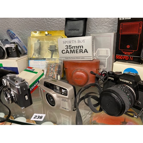 236 - TWO SHELVES OF PENTAX MX, FUGICA, YASHIKA AND OTHER CAMERAS, LENSES AND ACCESSORIES