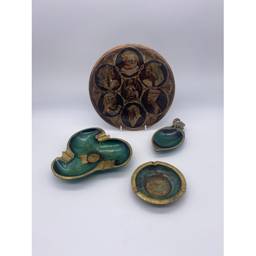 500 - THREE ISRAELI BRASS AND GREEN ENAMELLED ASHTRAYS AND A METAL WORK EGYPTIAN PLATE