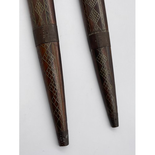 485 - PAIR OF EASTERN ROSE WOOD AND BRASS INLAID DECORATIVE DAGGERS