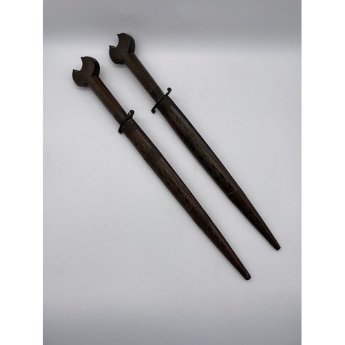 485 - PAIR OF EASTERN ROSE WOOD AND BRASS INLAID DECORATIVE DAGGERS