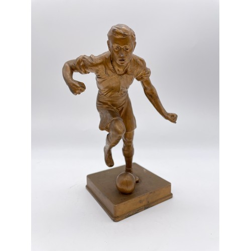 484 - GILDED SPELTER FIGURE OF A FOOTBALLER 21cm