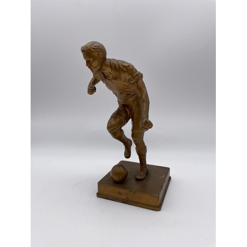 484 - GILDED SPELTER FIGURE OF A FOOTBALLER 21cm