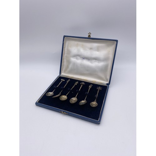 412 - CASED SET OF 900( SILVER) WHITE METAL NOVELTY FINIAL TEA SPOONS