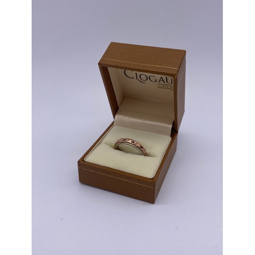 488 - CLOGAU SILVER AND ROSE GOLD OVERLAY ETERNITY BAND SIZE M