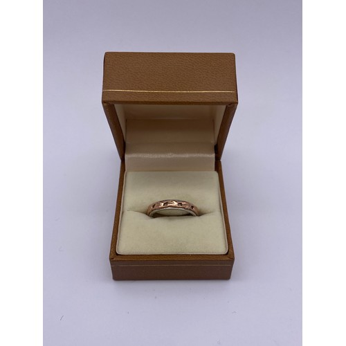 488 - CLOGAU SILVER AND ROSE GOLD OVERLAY ETERNITY BAND SIZE M