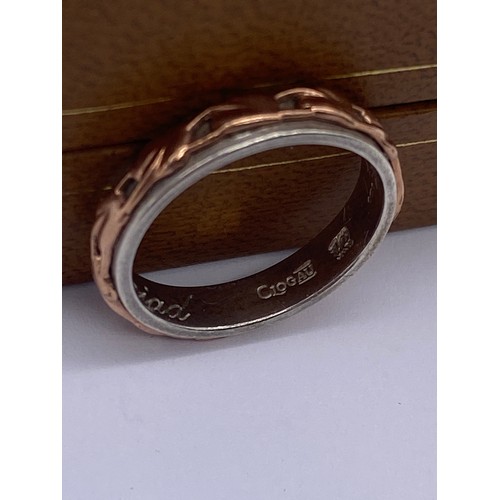 488 - CLOGAU SILVER AND ROSE GOLD OVERLAY ETERNITY BAND SIZE M