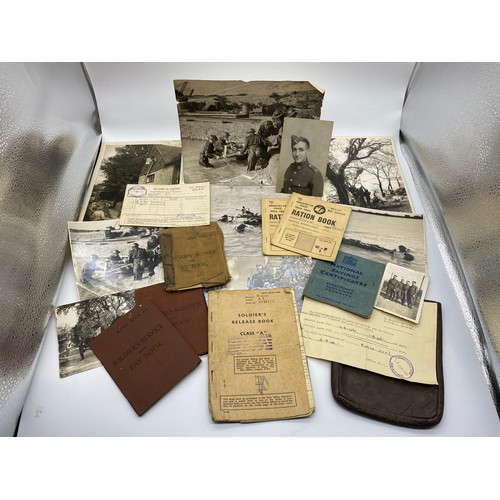 490 - BAG CONTAINING WWII SOLDIER SERVICE BOOK, RECORD OF SERVICE, PHOTOGRAPHS, NATOINAL SAVING CERTIFICTA... 