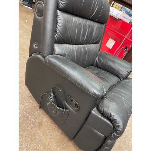 70A - BLACK LEATHER RECLINING ARMCHAIR