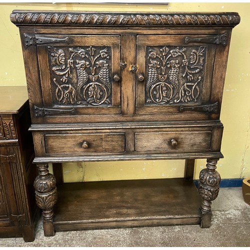 162 - REPRODUCTION OAK CARVED BULBOUS LEG CLOSED CUPBOARD WITH PANELLED DOORS