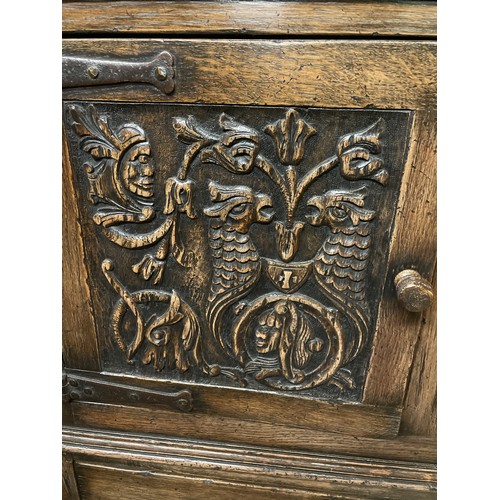 162 - REPRODUCTION OAK CARVED BULBOUS LEG CLOSED CUPBOARD WITH PANELLED DOORS