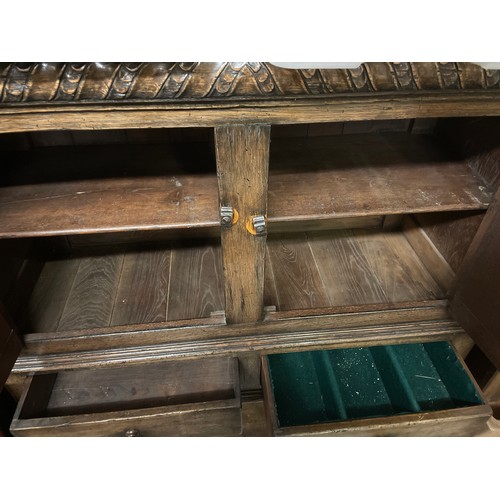 162 - REPRODUCTION OAK CARVED BULBOUS LEG CLOSED CUPBOARD WITH PANELLED DOORS