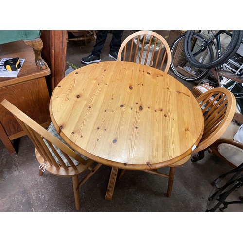 75 - PINE CIRCULAR PEDESTAL BREAKFAST TABLE AND HOOP BACK CHAIRS