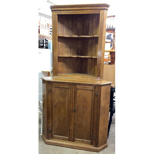 92 - GOOD QUALITY OAK TWO DOOR CORNER CABINET WITH OPEN SHELVING TOP