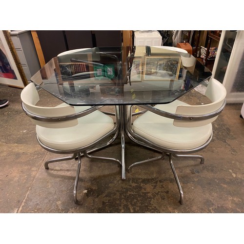 83 - 1970S HABITAT STYLE SMOKE GLASS OCTAGONAL TOPPED TABLE AND FOUR TUB SWIVEL CHAIRS