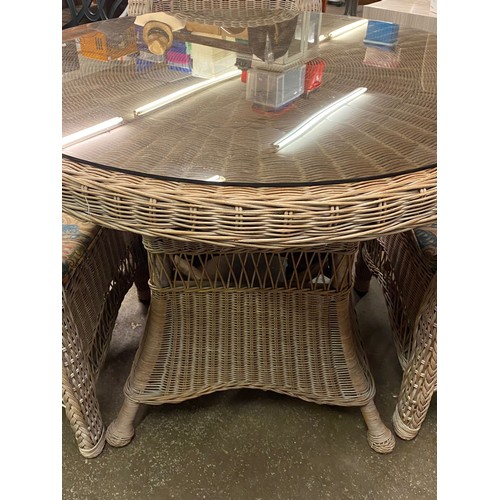 84 - BLEACHED RATTAN CIRCULAR/PATIO TABLE AND FOUR HIGH BACK CHAIRS