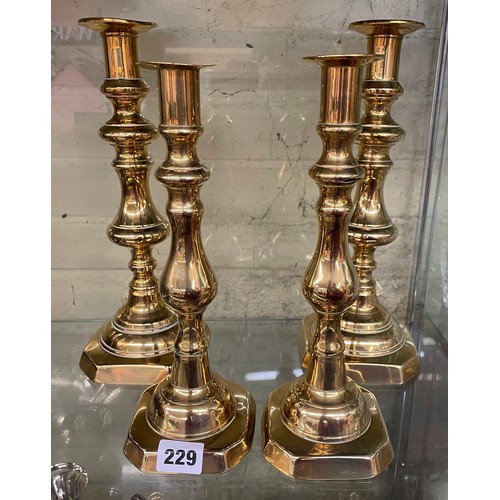 229 - TWO PAIR OF BRASS BALUSTER KNOPPED CANDLE STICKS