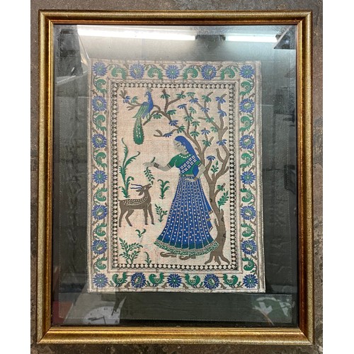 331 - SILK EMBROIDERD PANEL OF AN INDIAN FEMALE IN A GARDEN FRAMED AND GLAZED