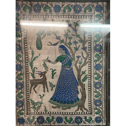 331 - SILK EMBROIDERD PANEL OF AN INDIAN FEMALE IN A GARDEN FRAMED AND GLAZED