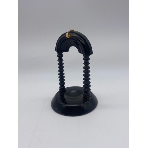 508 - SILVER ENGRAVED FOB WATCH ON EBONISED TURNED MANTLE HOLDER