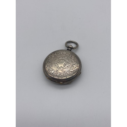 508 - SILVER ENGRAVED FOB WATCH ON EBONISED TURNED MANTLE HOLDER