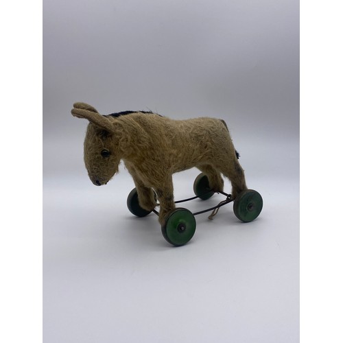 431 - EARLY 20TH CENTURY PLUSH PULL ALONG DONKEY