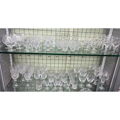 204 - TWO SHELF OF VARIOUS SETS OF CUT GLASS TUMBLERS, WINES, AND SHERRY GLASSES