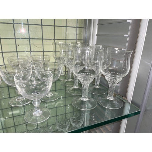 204 - TWO SHELF OF VARIOUS SETS OF CUT GLASS TUMBLERS, WINES, AND SHERRY GLASSES