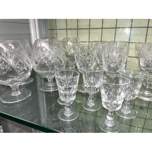 204 - TWO SHELF OF VARIOUS SETS OF CUT GLASS TUMBLERS, WINES, AND SHERRY GLASSES