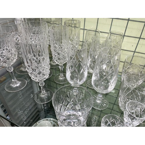 204 - TWO SHELF OF VARIOUS SETS OF CUT GLASS TUMBLERS, WINES, AND SHERRY GLASSES