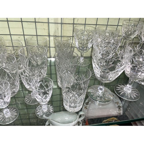 204 - TWO SHELF OF VARIOUS SETS OF CUT GLASS TUMBLERS, WINES, AND SHERRY GLASSES