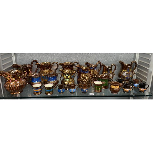 199 - SHELF OF COPPER LUSTRE RESIST AND PAINTED JUGS AND MUGS