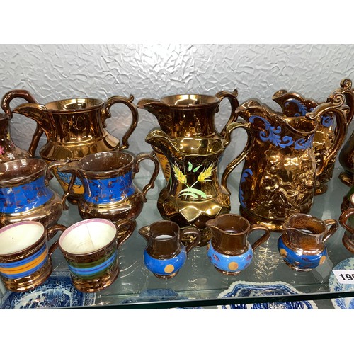 199 - SHELF OF COPPER LUSTRE RESIST AND PAINTED JUGS AND MUGS