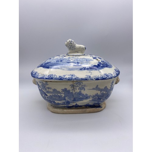 261 - 19TH CENTURY BLUE AND WHITE SOUP TUREEN AND COVER WITH LION FINIAL