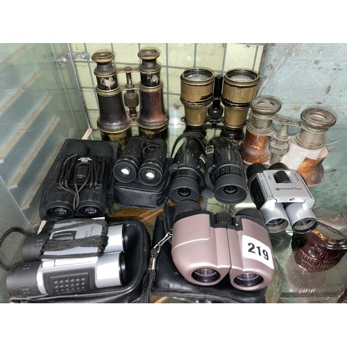 219 - SELECTION OF COMPACT FOLDING BINOCULARS AND FIELD GLASSES