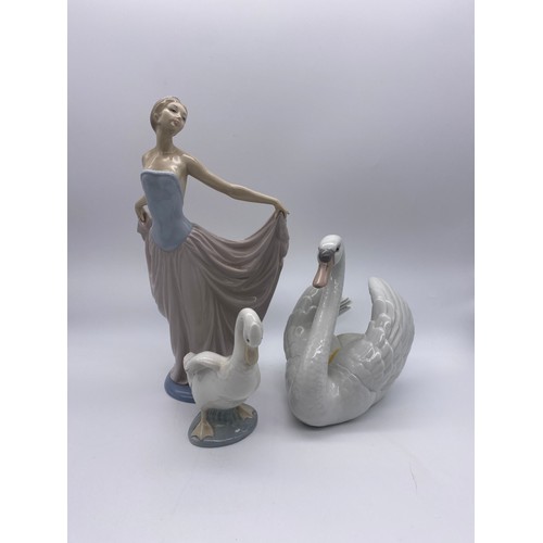 215 - LLADRO FEMALE FIGURE, LARGE SWAN AND A NAO GOOSE