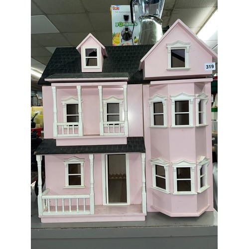 319 - LARGE PINK PAINTED DOLLS HOUSE